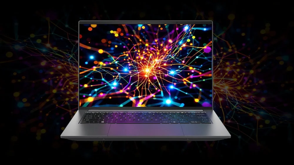 ノートパソコンと抽象的なデジタルパターンの画像