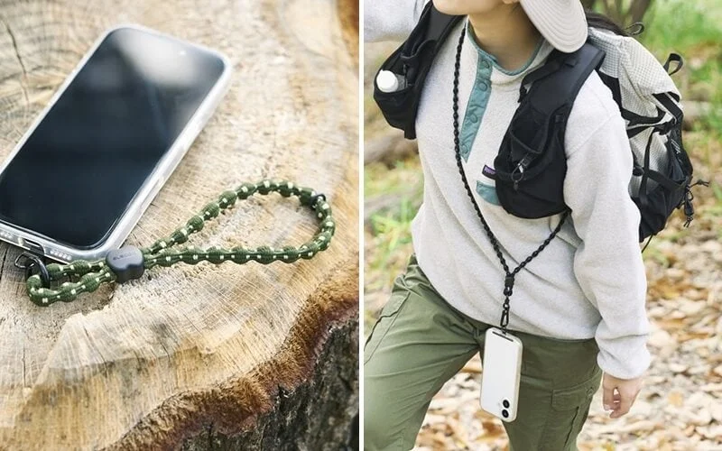 木の上に置かれたスマホとリストストラップ、アウトドアでネックストラップを使いスマホを携帯する人物