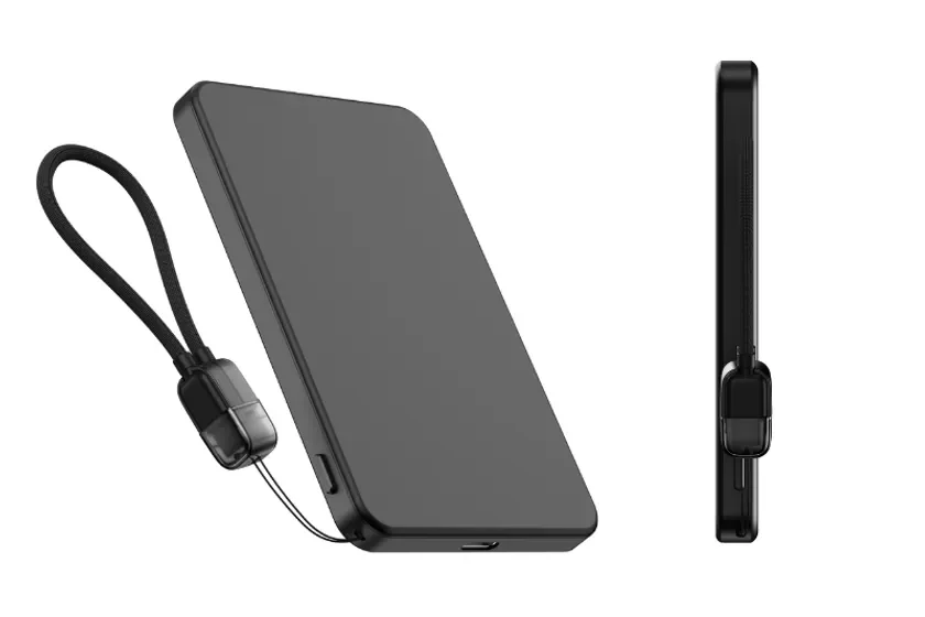 黒くて薄型の電子機器で、手首にかけられるストラップが付いています。モバイルバッテリーやポータブルSSDのようなデバイスに見えます。