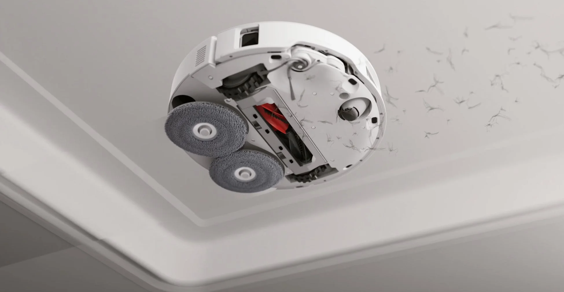 白いロボット掃除機が稼働している様子を下方から捉えた画像です。