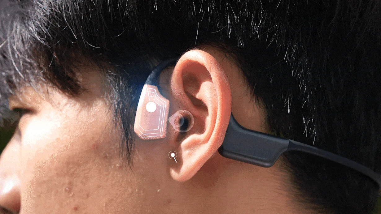 耳に装着された未来的なイヤホン