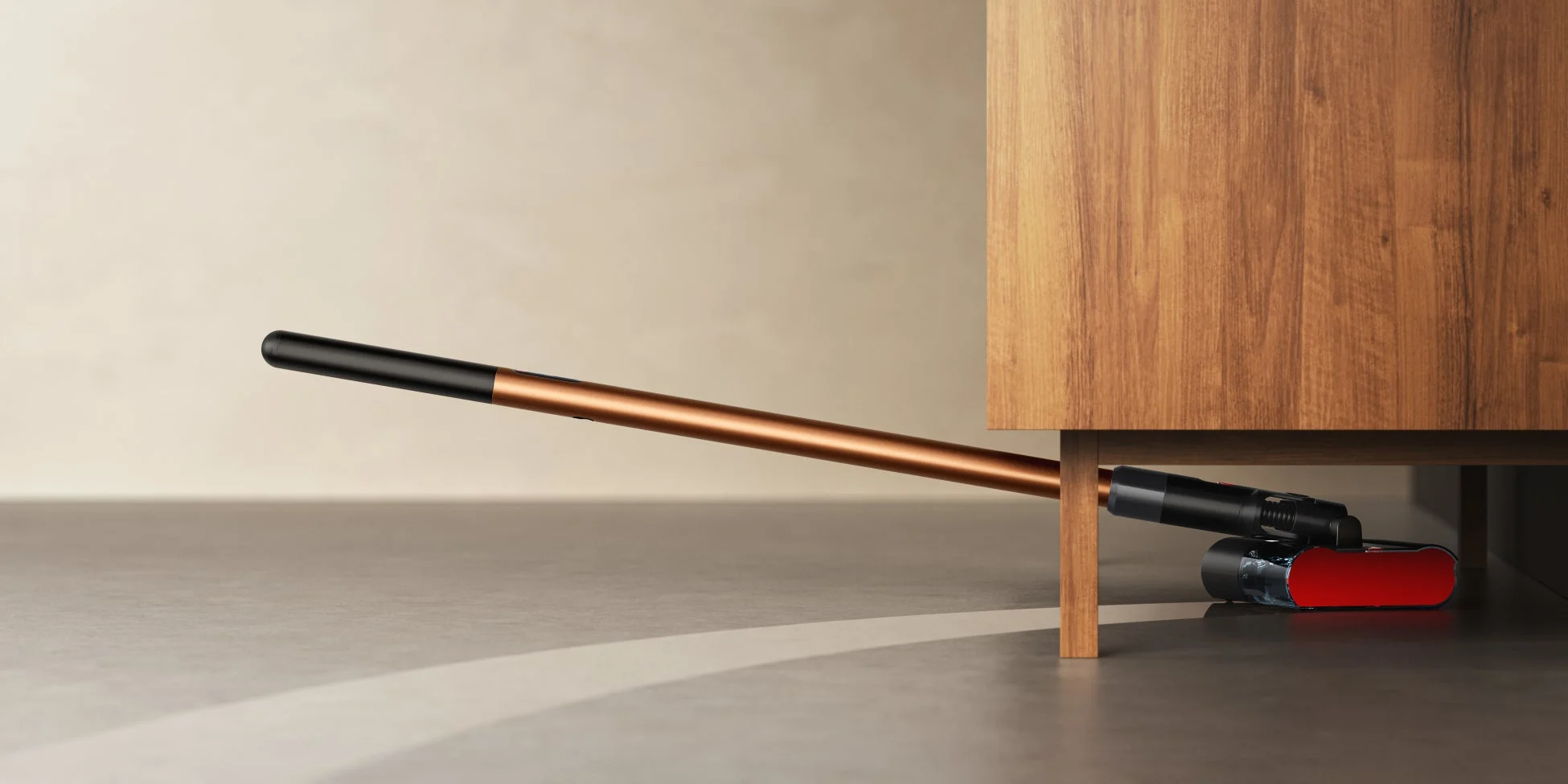 Dyson PencilWash™が家具の下を掃除する様子