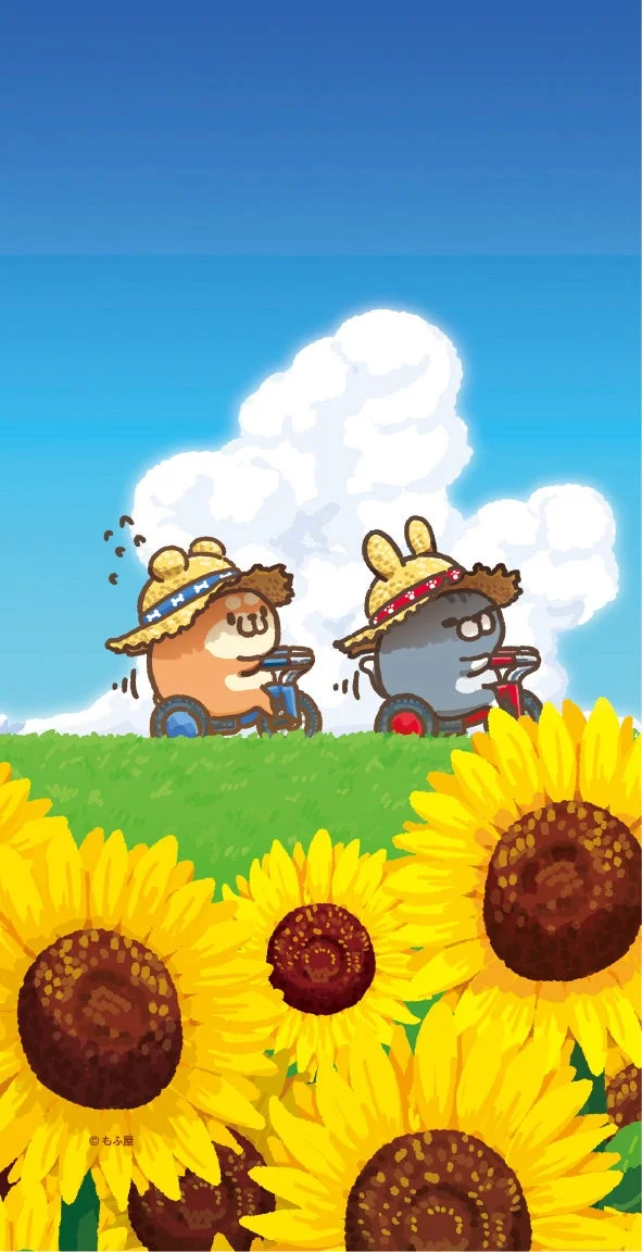 ひまわり畑を三輪車で走る麦わら帽子のキャラクターたち