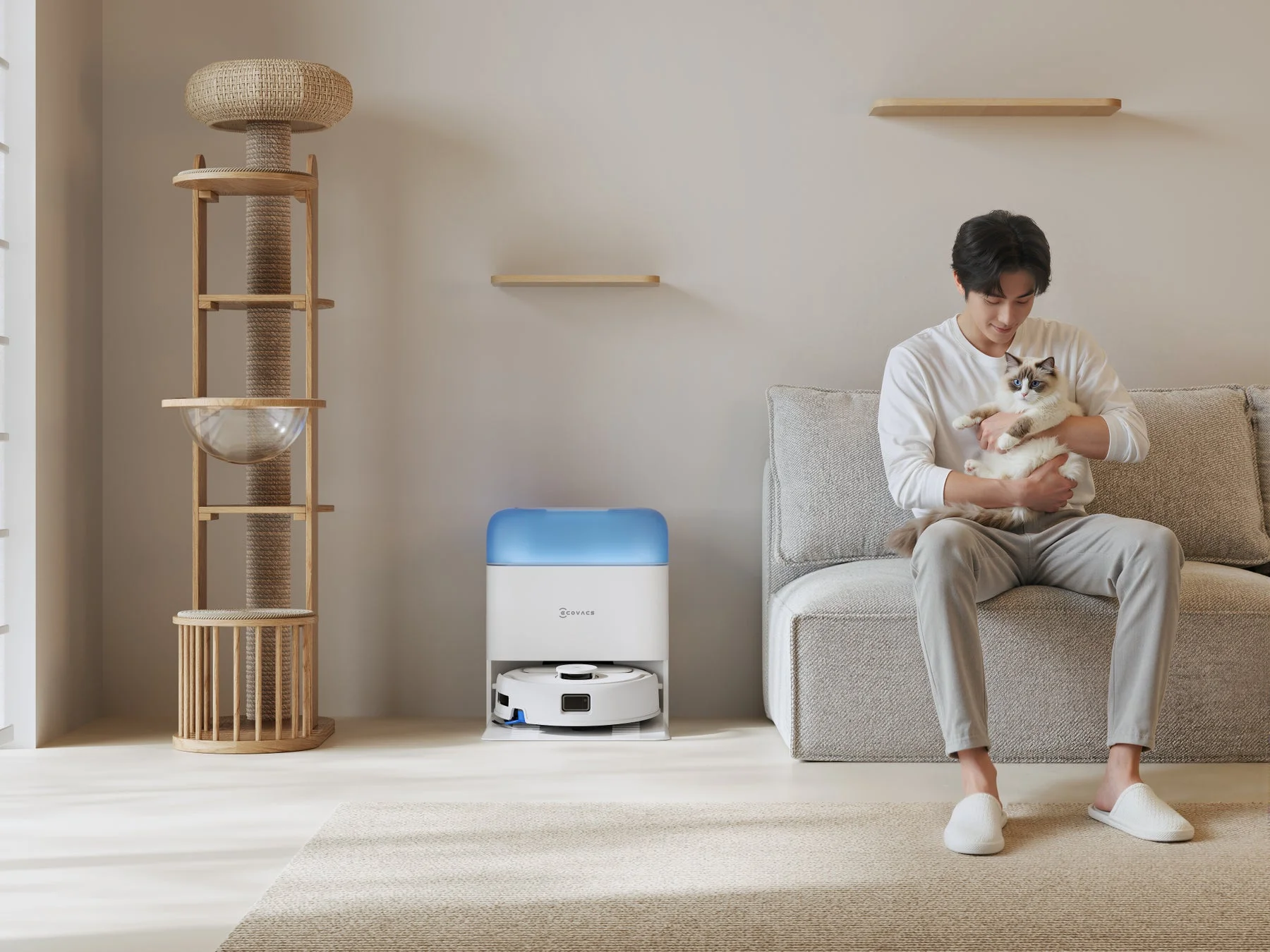 男性と猫とロボット掃除機とステーション