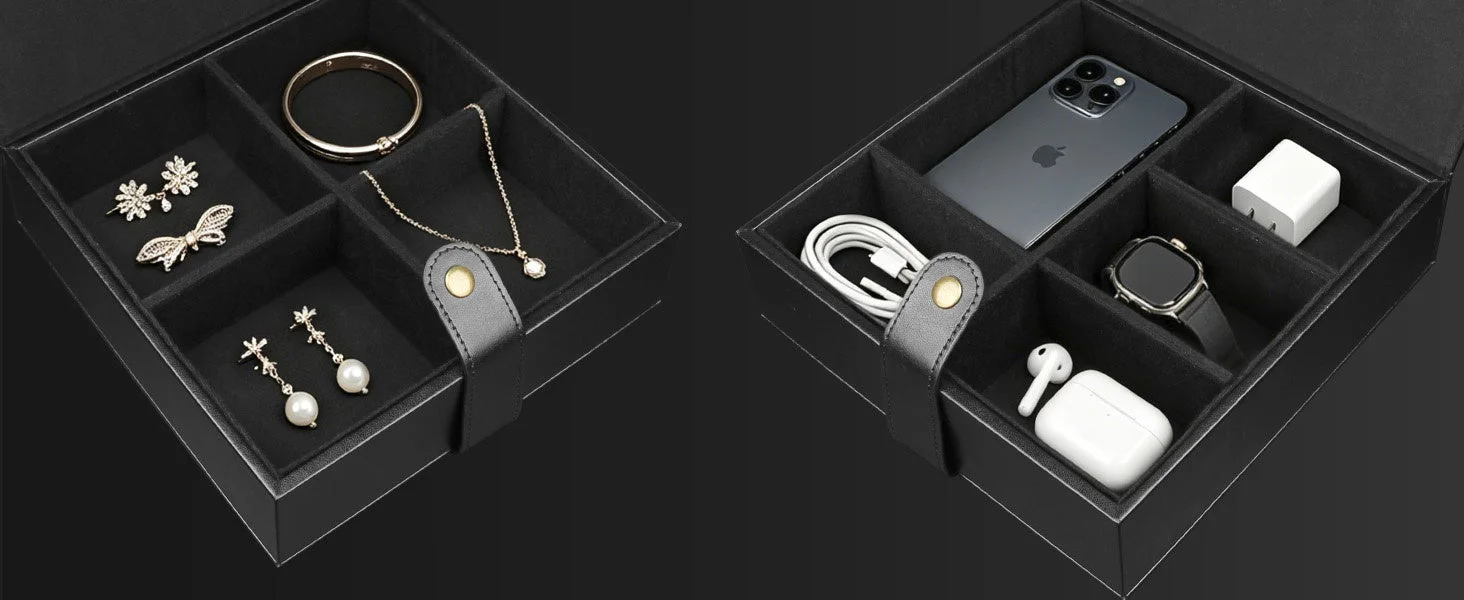 仕切りのある黒い収納ボックスに、アクセサリー類や電子機器が収納されている様子